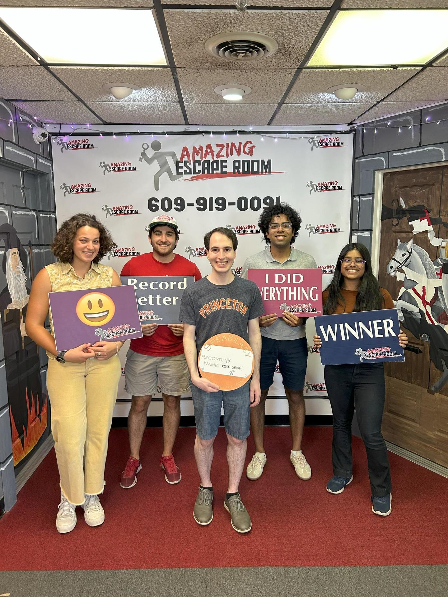 Rosen Research Group members celebrating an escape room record